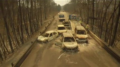 Portugal forest fire: Drone footage shows burnt-out cars - BBC News