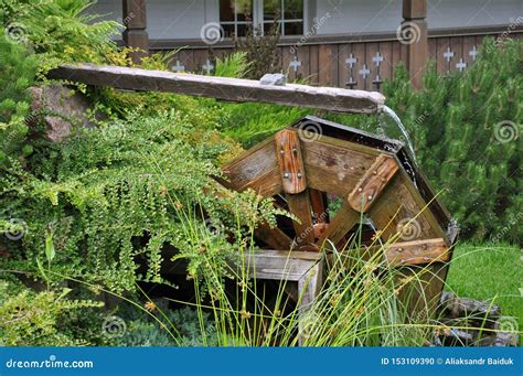 Driving Mill Wheel with Falling Water in the Garden Stock Photo - Image ...