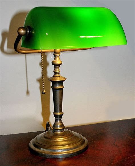 The Bankers Antique Lamp is handmade in England with solid oxidized brass base and stem, the ...