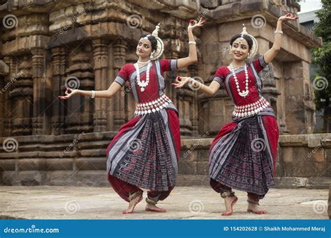 Two Indian Classical Odissi Dancers Striking A Pose In Front Of Mukteshvara Temple,Bhubaneswar ...