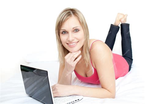 Premium Photo | Modern woman lying with a laptop on sofa