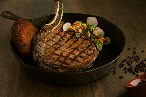 Bone-In Cowboy Ribeye* - Dinner Menu - The Butcher's Son