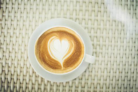 Latte art coffee with heart-shaped milk foam 1991012 Stock Photo at Vecteezy