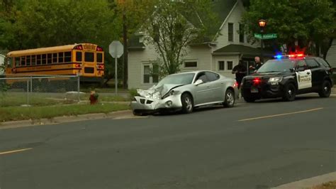 1 injured after crash between car, school bus carrying 12 kids in St ...