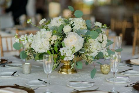 Low lush centerpiece with white peonies, seeded eucalyptus, white stock, whi… | White flower ...