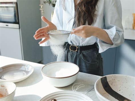 A Person Sifting Flour · Free Stock Photo