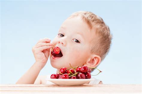 Child with Red Berries, Boy Eats and Chooses Cherry. Stock Image - Image of people, juicy: 117296001