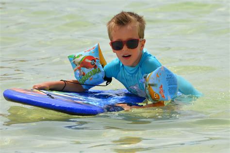 Free Images : beach, sea, people, play, wave, boy, vacation, surfboard, child, leisure, swimming ...