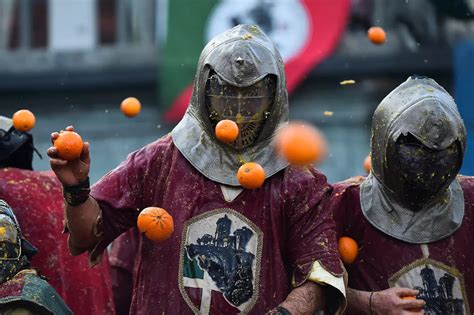 Fun-filled images from Italy's craziest festival ‘Battle of Oranges’ | Photogallery - ETimes