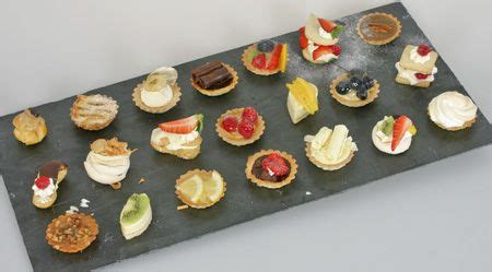 Dessert canapes - traditional recipes such as key lime pie, fruit tarts, eclairs, pavlovas ...