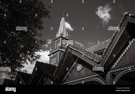 The spire rises over the famed wooden church, or the Catholic Kontum Cathedral, in the city of ...