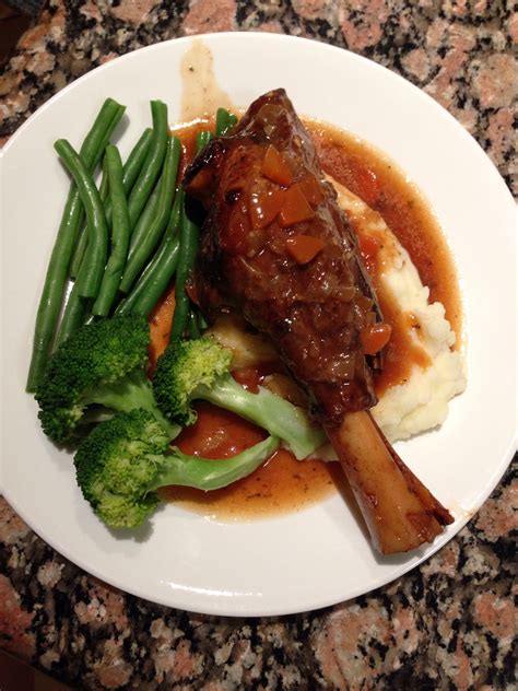 Slow roasted lamb shanks on smooth mashed potato with a beer infused gravy served with broccoli ...