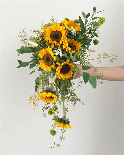 Cascading Sunflower Bridal Bouquet by Eufloria | Bridestory.com