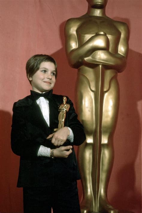 Ten-year-old Tatum O'Neal holding her Oscar after winning the Best Supporting Actress award for ...