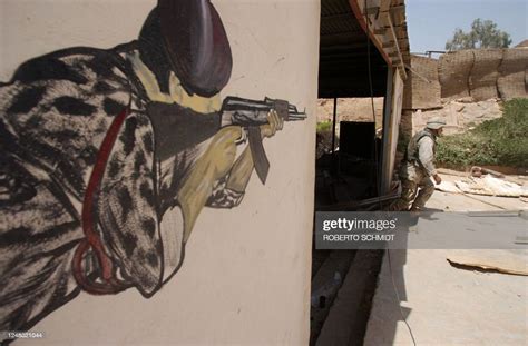 US soldier walks in an abandoned Fedayeen Saddam militia training... News Photo - Getty Images