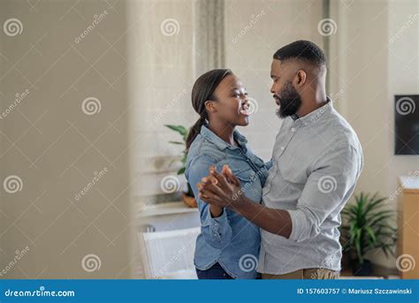 Smiling Young African American Couple Dancing Together at Home Stock Image - Image of caring ...