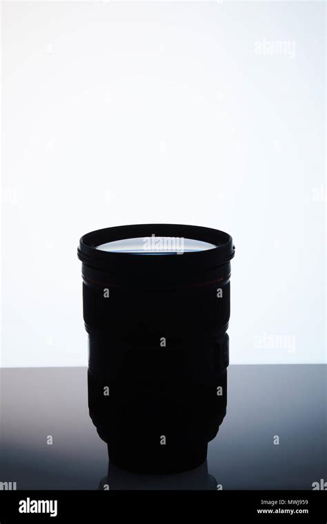 single camera lens silhouette on white Stock Photo - Alamy