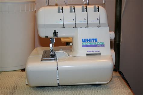 Tammy's Craft Emporium: White Superlock 2000 serger and dog bed.