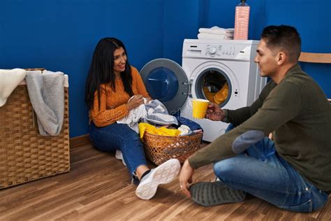 Man and Woman Couple Washing Clothes Drinking Coffee at Laundry Room Stock Photo - Image of ...