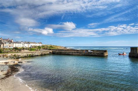 Craster Harbour in Northumberland, home of some excellent KIPPERS Dunstanburgh Castle, British ...