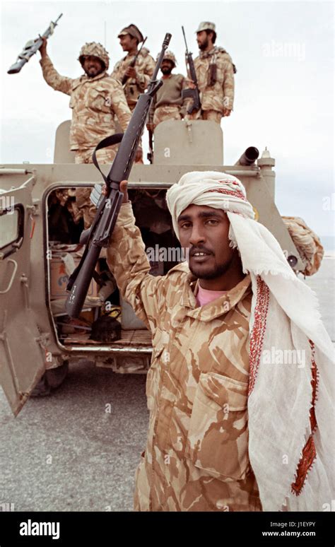 Saudi Arabian national guard soldiers celebrate after leading coalition forces in the recapture ...