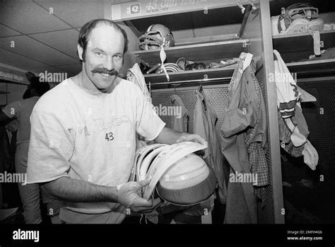 Dallas Cowboys safety Cliff Harris gets his equipment in order before ...