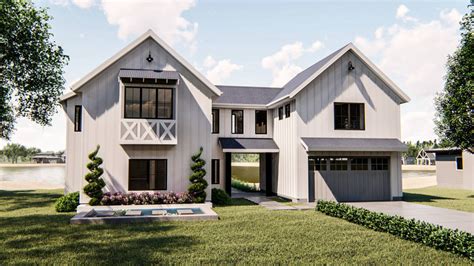 This 1.5-story, Modern Farmhouse lake house plan is highlighted by a ...