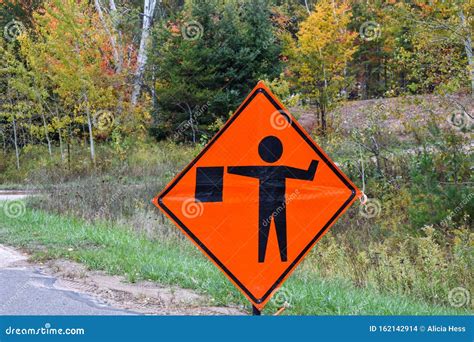 Orange Flagman Ahead Construction Sign. Flagger Ahead Stock Photo ...