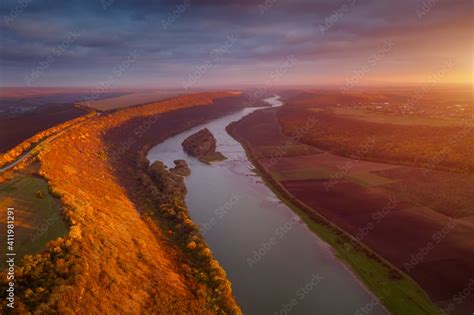 Beautiful top view of winding river in sunset. Scenic image of drone ...