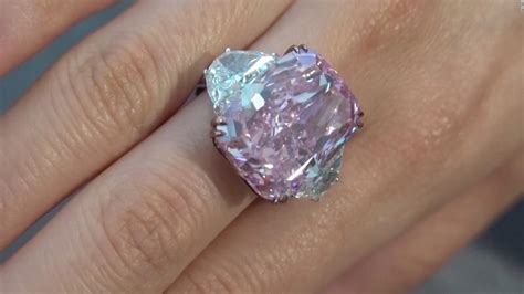 Rare purple-pink diamond breaks auction record - CNN Video