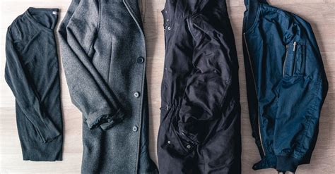 Flat Lay Of Jackets On Brown Wooden Floor · Free Stock Photo