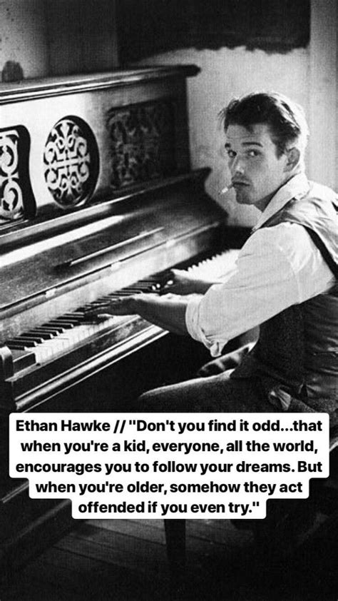 a man sitting at a piano in front of a quote