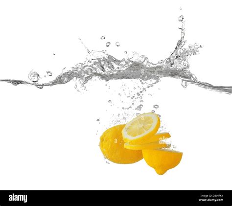 Fresh sliced lemon in water on white background Stock Photo - Alamy