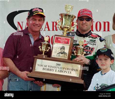 Bobby Labonte (R) and his brother Terry Labonte celebrate winning the ...