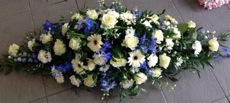 Blue and White Casket Spray – buy online or call 01375 374155