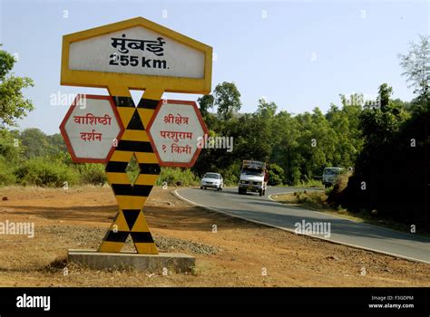 Mumbai Goa Highway showing Mumbai 255km from Chiplun ; Dist Raigad ; Maharashtra ; India Stock ...