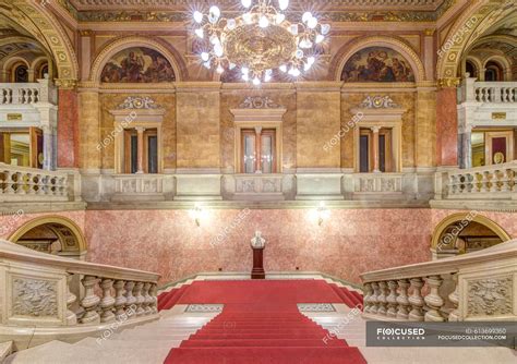 The Hungarian State Opera House, built in the 1880s, interior double staircase with a red carpet ...