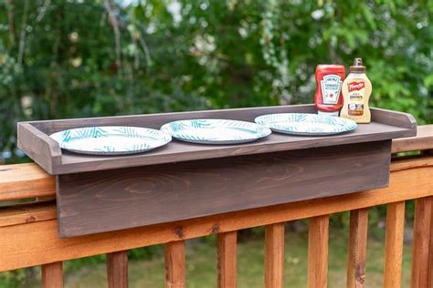 This DIY balcony railing table is perfect for adding extra space for ...