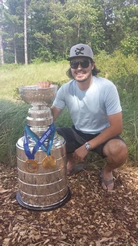 Drew Doughty Hanging his 2 Olympic Gold Medals on Stanley Cup | HockeyGods