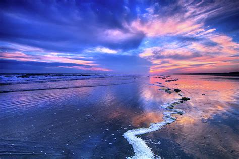 Dramatic Sunset on Sunset Beach Photograph by Dan Carmichael - Fine Art America