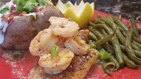 Baked catfish topped with sauteed shrimp! Seasoned with cajun seasoning garlic and lemon ...