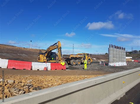 Volvo dumper truck on construction site with reinforced concrete pylons ...