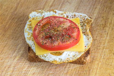 Healthy Breakfast: Fried Egg on a Whole Wheat Toast Stock Image - Image of organic, board: 97614975