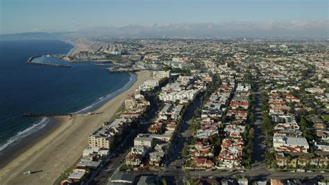 7.6K stock footage aerial video flying over Torrance Beach and pan across Redondo Beach ...