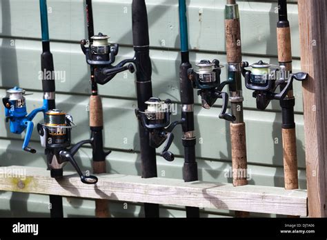 Fishing rods and reels Stock Photo - Alamy