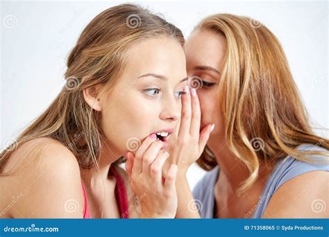 Happy Young Women Whispering Gossip at Home Stock Image - Image of lifestyle, beautiful: 71358065