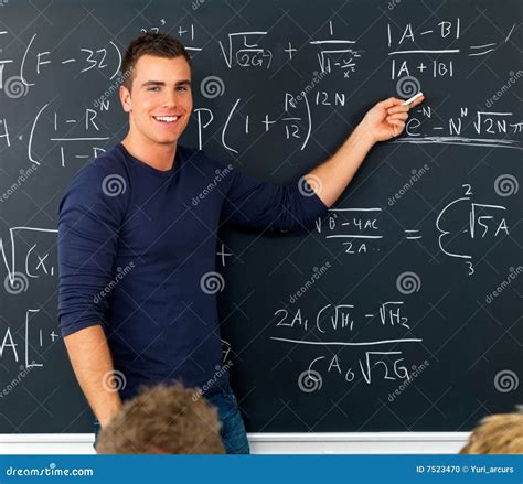 Stock Photo: Teacher pointing at blackboard teaching math. Image: 7523470