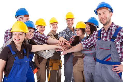 Diverse group of construction workers stacking hands – Firma Reimer