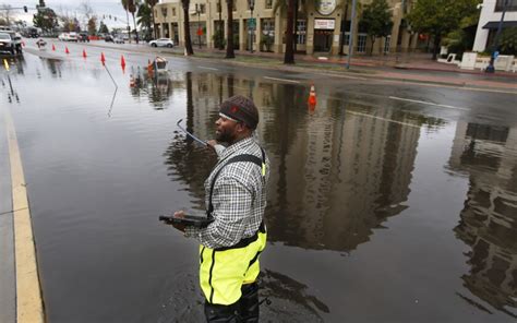 Holiday storm downs trees, floods freeways across Southern California ...