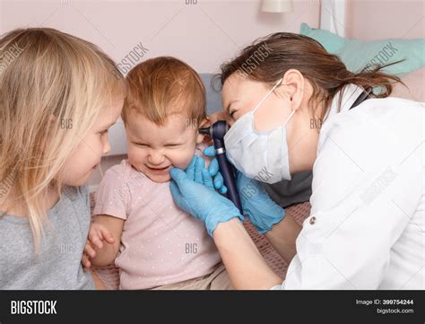 Pediatrician Examines Image & Photo (Free Trial) | Bigstock